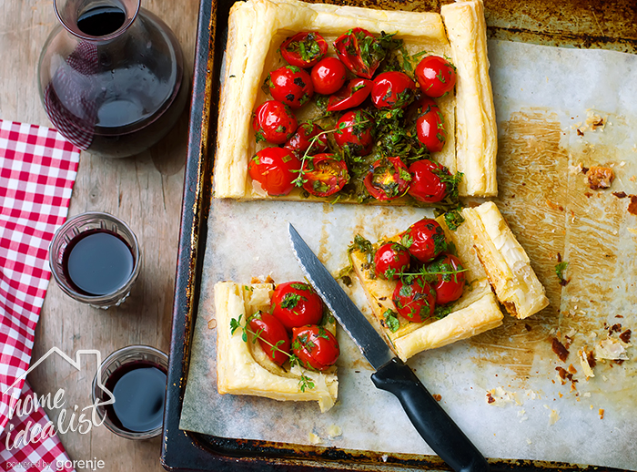 tart with cherry tomatoes and herbs. selective focus