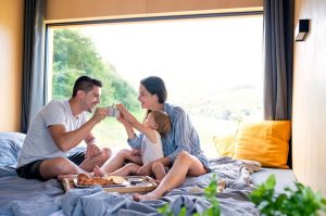 young_couple_with_small_daughter_indoors_shutterstock (1)